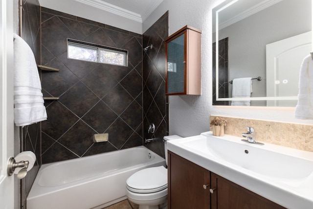 full bathroom featuring crown molding, vanity, tiled shower / bath combo, and toilet