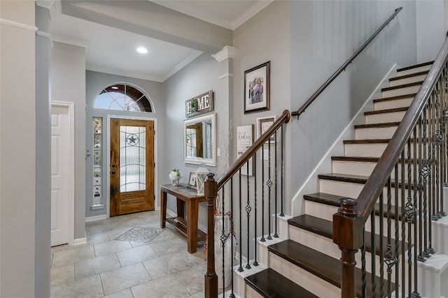 foyer featuring ornamental molding