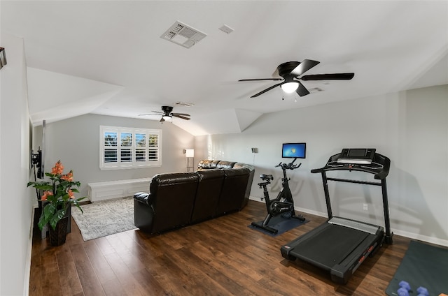 exercise area featuring ceiling fan, dark hardwood / wood-style floors, and lofted ceiling