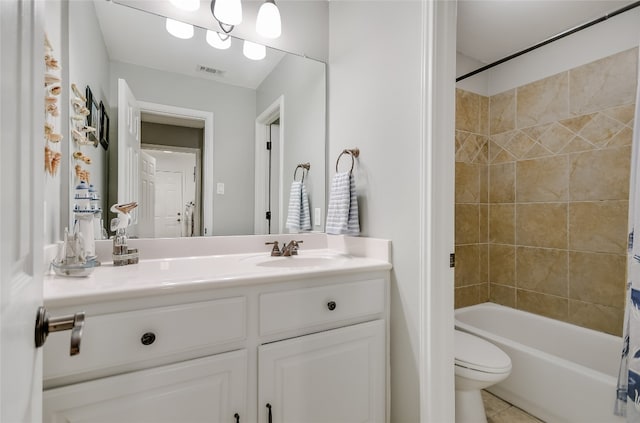 full bathroom featuring tile patterned flooring, shower / tub combo, vanity, and toilet