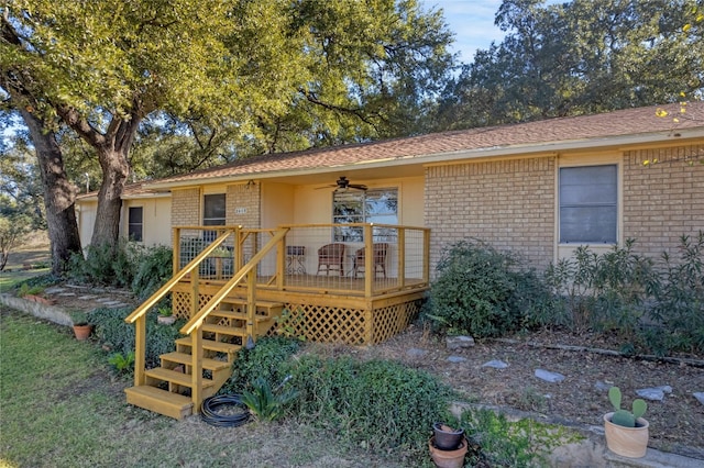 view of front of home featuring a deck and ceiling fan