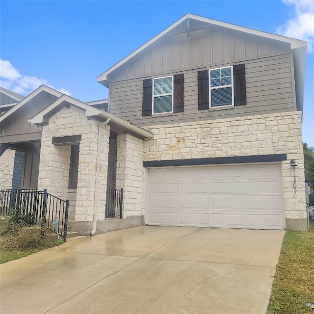 11303 Copper Spring Dr Unit 87, Austin, TX 78748 - view of front of property with stone siding, a garage, board and batten siding, and concrete driveway