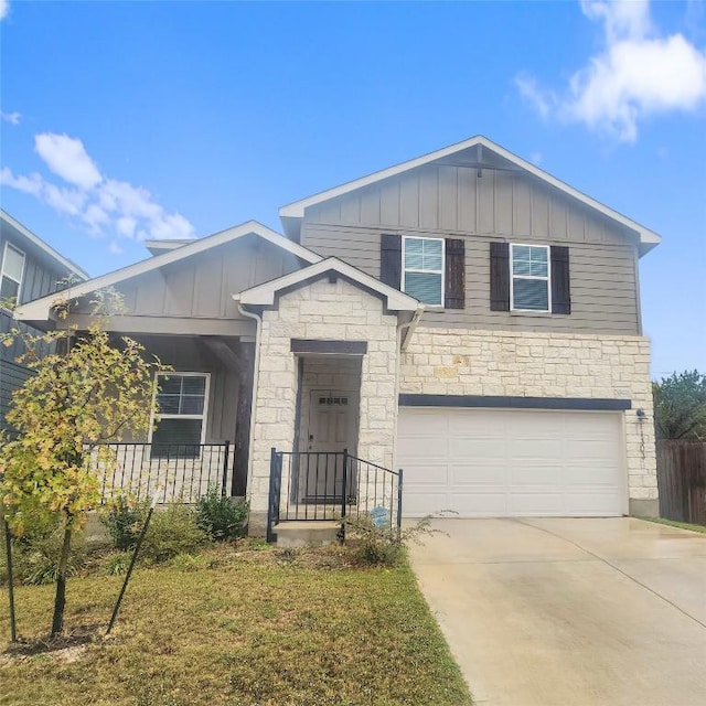 11303 Copper Spring Dr Unit 87, Austin, TX 78748 - view of front of house with board and batten siding, stone siding, driveway, and a garage