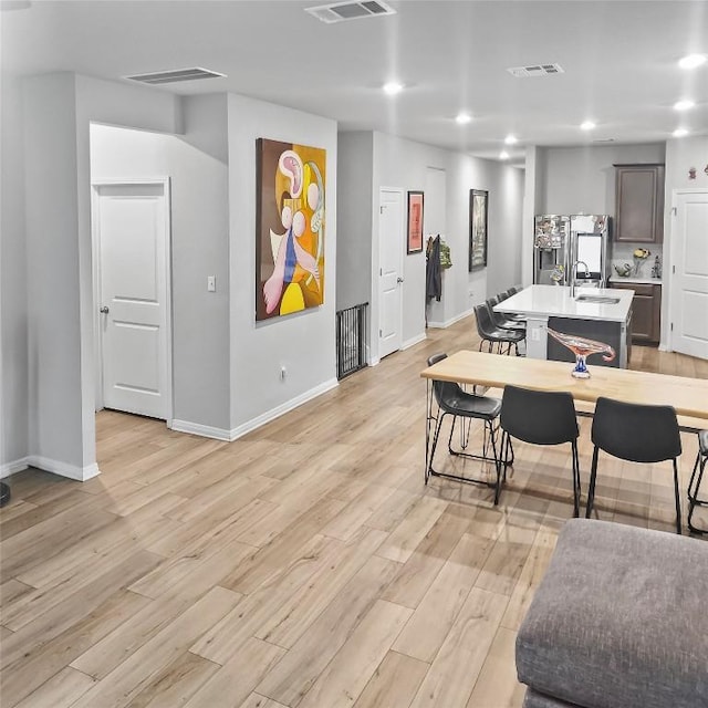 11303 Copper Spring Dr Unit 87, Austin, TX 78748 - dining space featuring light wood finished floors and recessed lighting