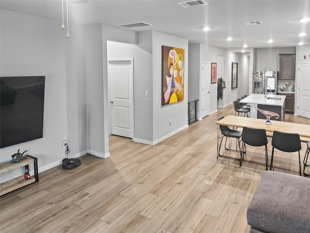 11303 Copper Spring Dr Unit 87, Austin, TX 78748 - living area featuring light wood-style floors and recessed lighting