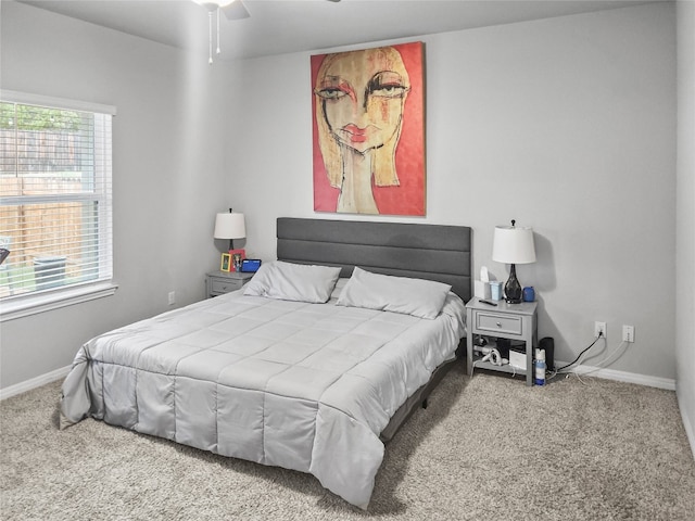 bedroom with ceiling fan and carpet