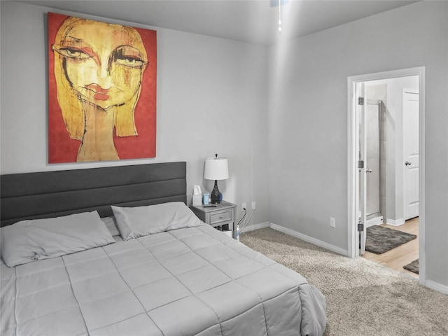 carpeted bedroom featuring connected bathroom