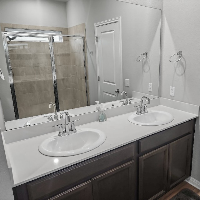 bathroom with vanity and an enclosed shower