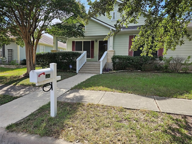 view of front facade with a porch and a front yard