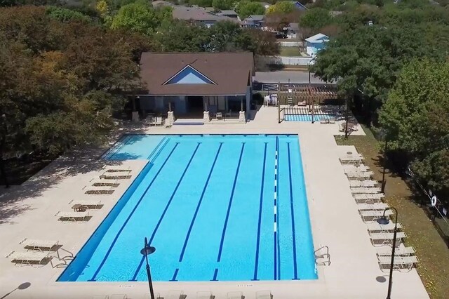 view of swimming pool featuring a patio area