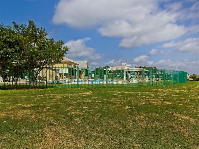 view of home's community with a lawn