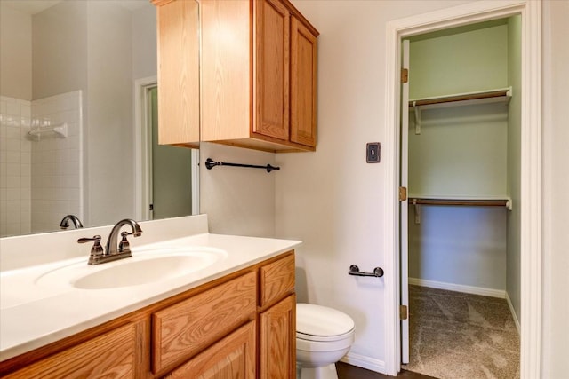 11000 Anderson Mill Rd Unit 9, Austin, TX 78750 - bathroom with vanity, tiled shower, and a walk in closet
