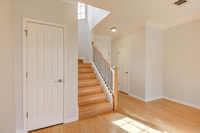 11000 Anderson Mill Rd Unit 9, Austin, TX 78750 - stairs featuring wood finished floors and ornamental molding
