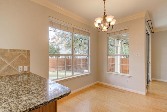 11000 Anderson Mill Rd Unit 9, Austin, TX 78750 - unfurnished dining area featuring crown molding, a chandelier, and light wood finished floors