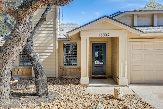 property entrance with a garage