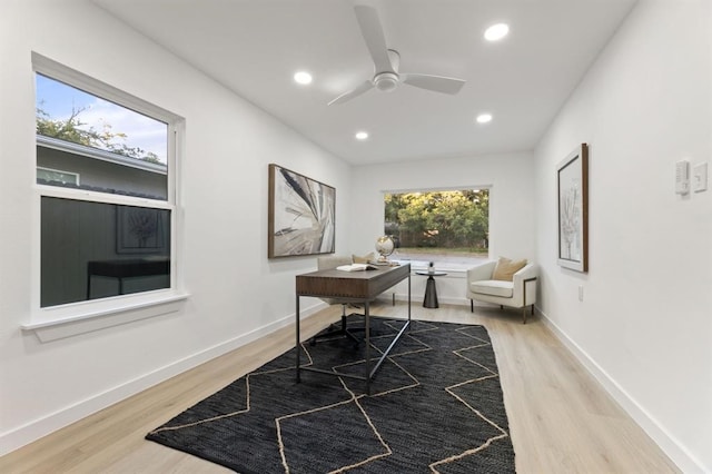 office with hardwood / wood-style floors and ceiling fan