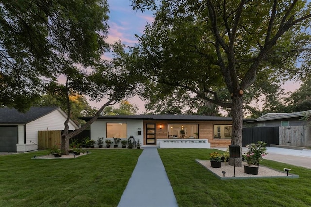 ranch-style house with a yard