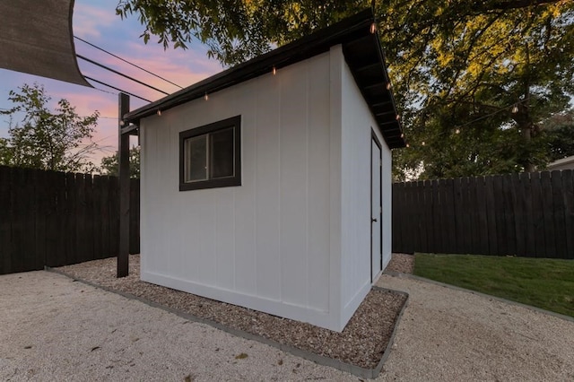 view of outdoor structure at dusk