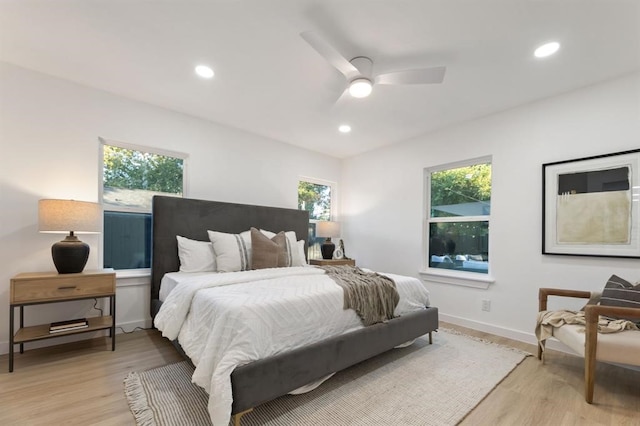 bedroom featuring light wood-type flooring and ceiling fan