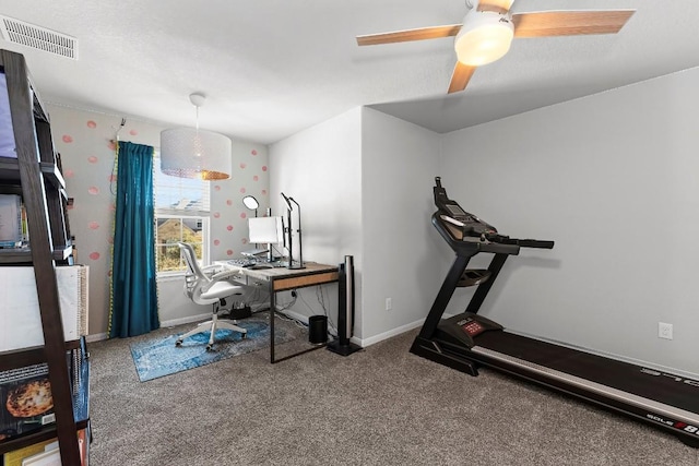 interior space with carpet floors and ceiling fan