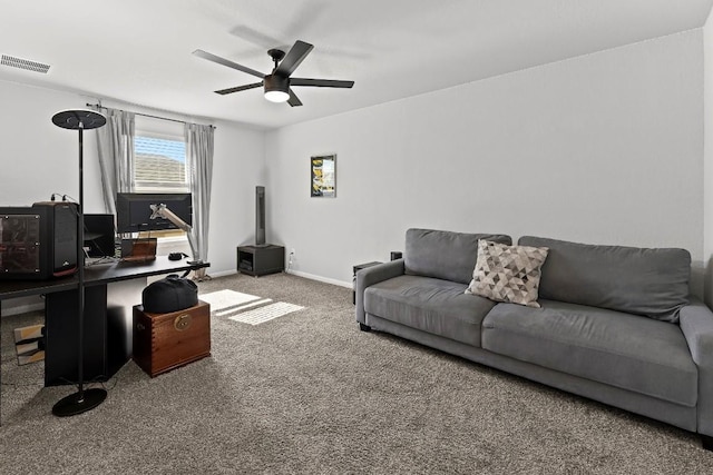 carpeted living room with ceiling fan