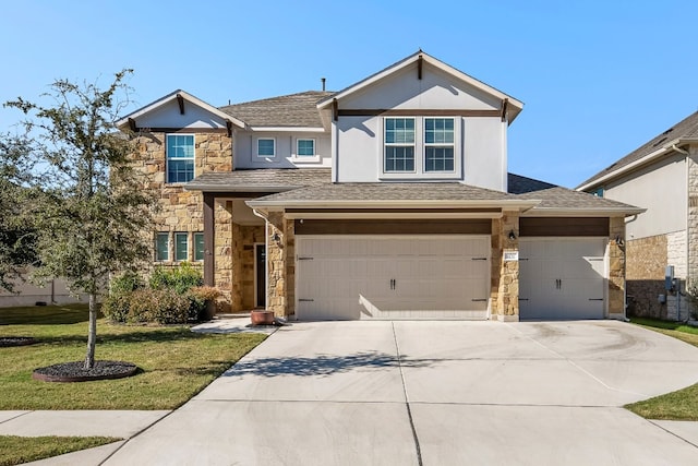 view of front of house with a garage and a front lawn