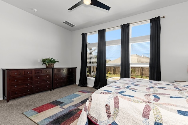 bedroom featuring ceiling fan and light carpet