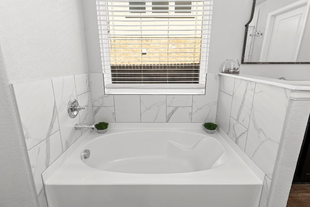 bathroom featuring a washtub