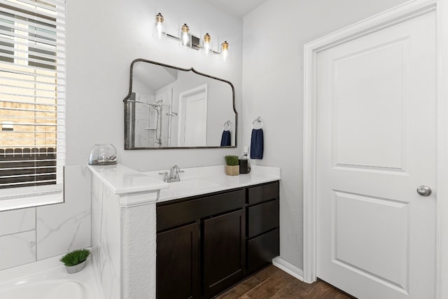 bathroom with vanity, wood-type flooring, and independent shower and bath