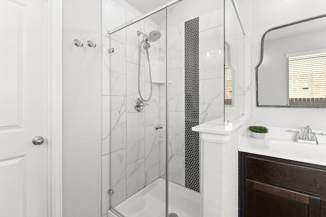 bathroom featuring vanity and an enclosed shower