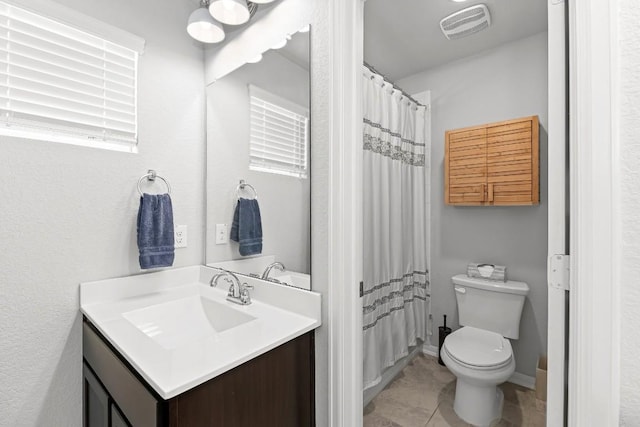 bathroom featuring tile patterned floors, vanity, toilet, and a shower with curtain