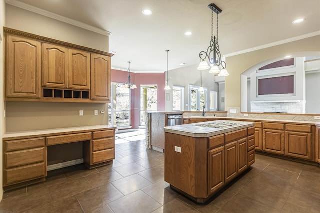 kitchen with sink, crown molding, a center island, stainless steel dishwasher, and pendant lighting