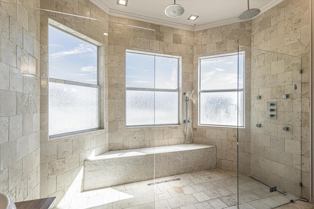 bathroom featuring crown molding and tiled shower