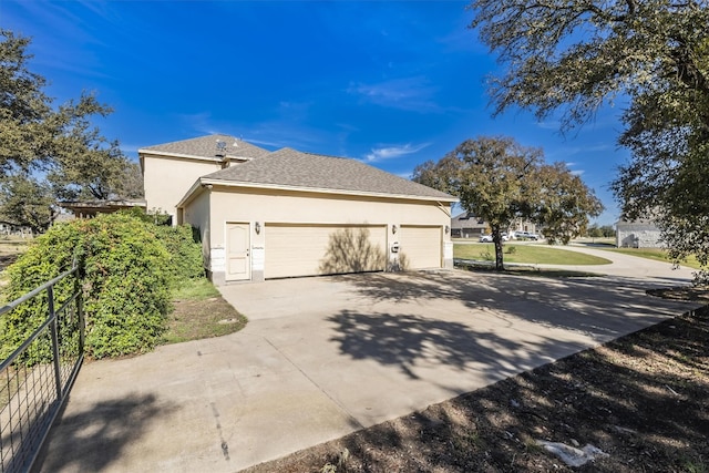 view of side of home featuring a garage