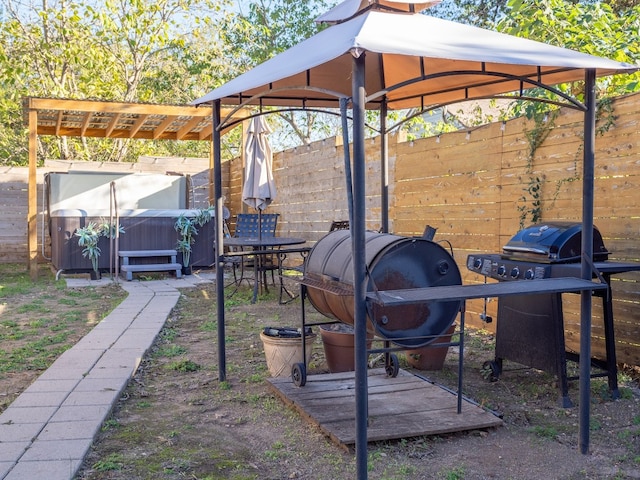 view of yard with a gazebo and a hot tub