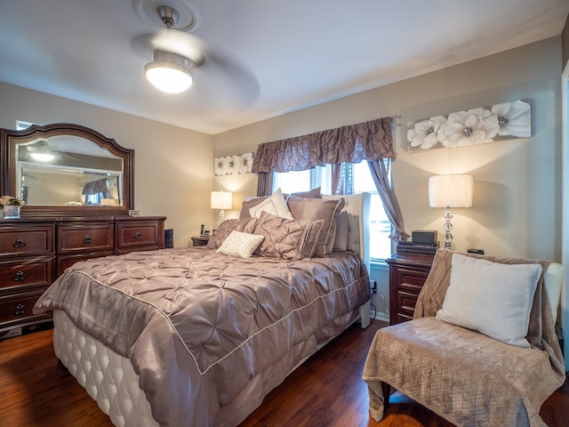 bedroom featuring ceiling fan and dark wood-type flooring