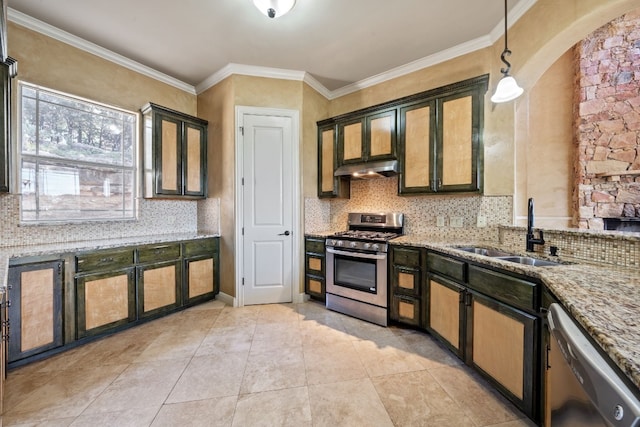 kitchen with crown molding, sink, appliances with stainless steel finishes, decorative light fixtures, and light stone counters