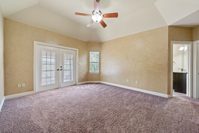 carpeted empty room with french doors, ceiling fan, and lofted ceiling