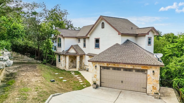 front facade with a front lawn and a garage