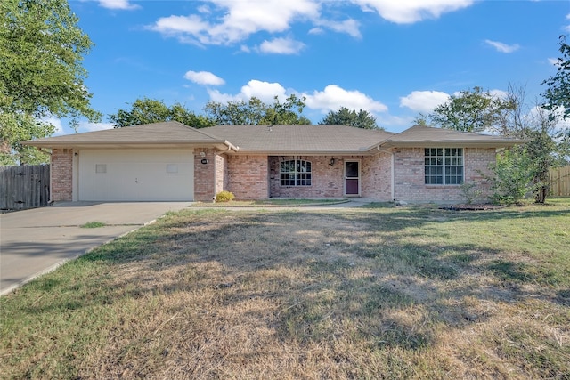 ranch-style home featuring a front yard and a garage