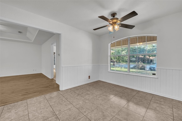 unfurnished room with ceiling fan and light hardwood / wood-style floors