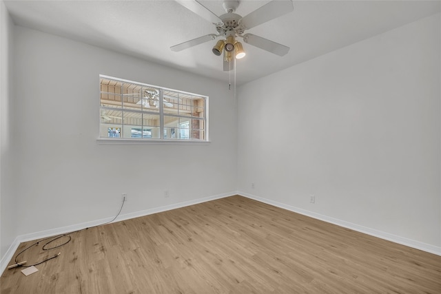 unfurnished room featuring light wood-type flooring and ceiling fan