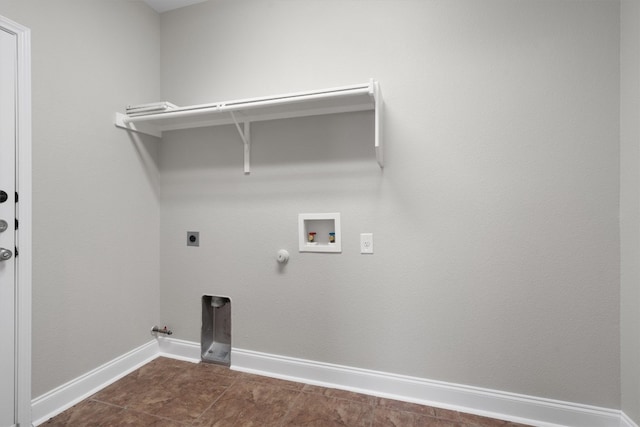 laundry room featuring gas dryer hookup, washer hookup, dark tile patterned flooring, and hookup for an electric dryer