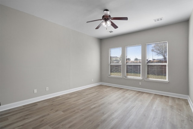 spare room with ceiling fan and light hardwood / wood-style flooring