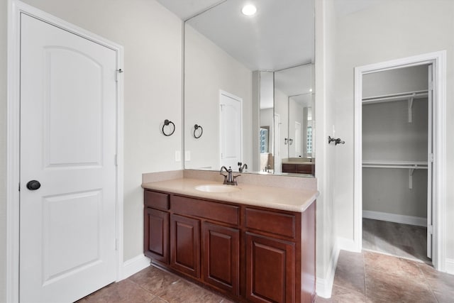 bathroom with tile patterned flooring and vanity