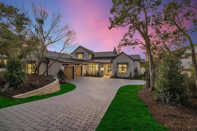 modern farmhouse style home with a garage