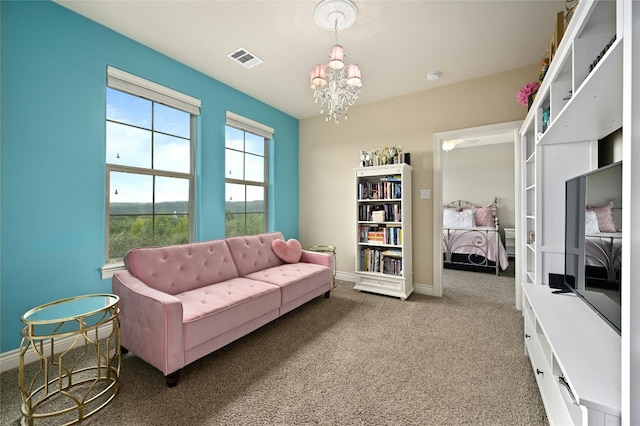 interior space with carpet flooring and a chandelier