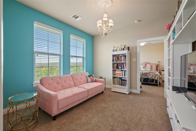 12920 Zen Gardens Way, Austin, TX 78732 - carpeted living room with a chandelier and baseboards