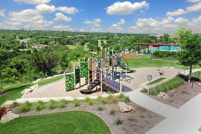 1205 Summer Moon Dr, Georgetown, TX 78628 - community jungle gym featuring a yard and a wooded view