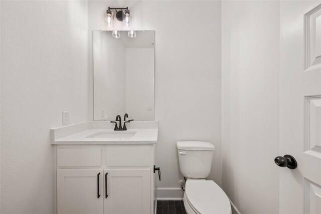 1205 Summer Moon Dr, Georgetown, TX 78628 - bathroom featuring toilet, baseboards, and vanity